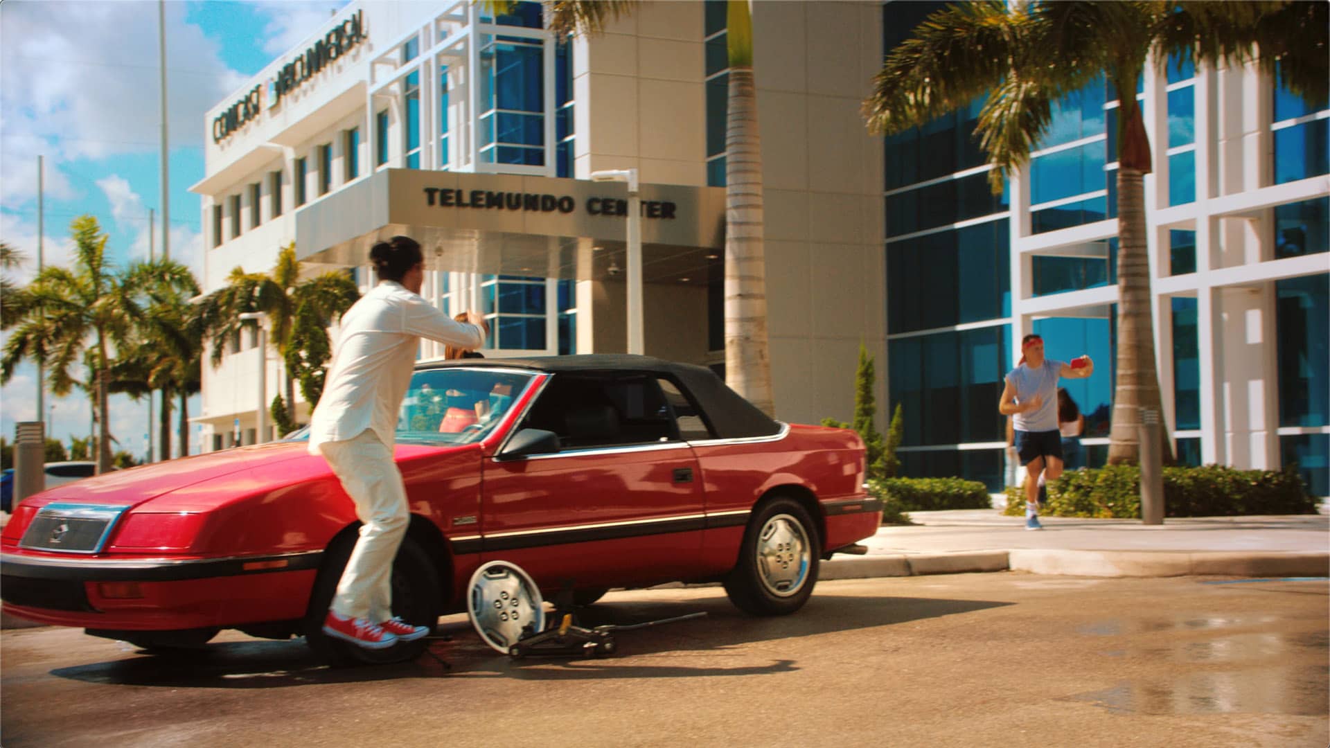Red convertible car in front of the Telemundo center