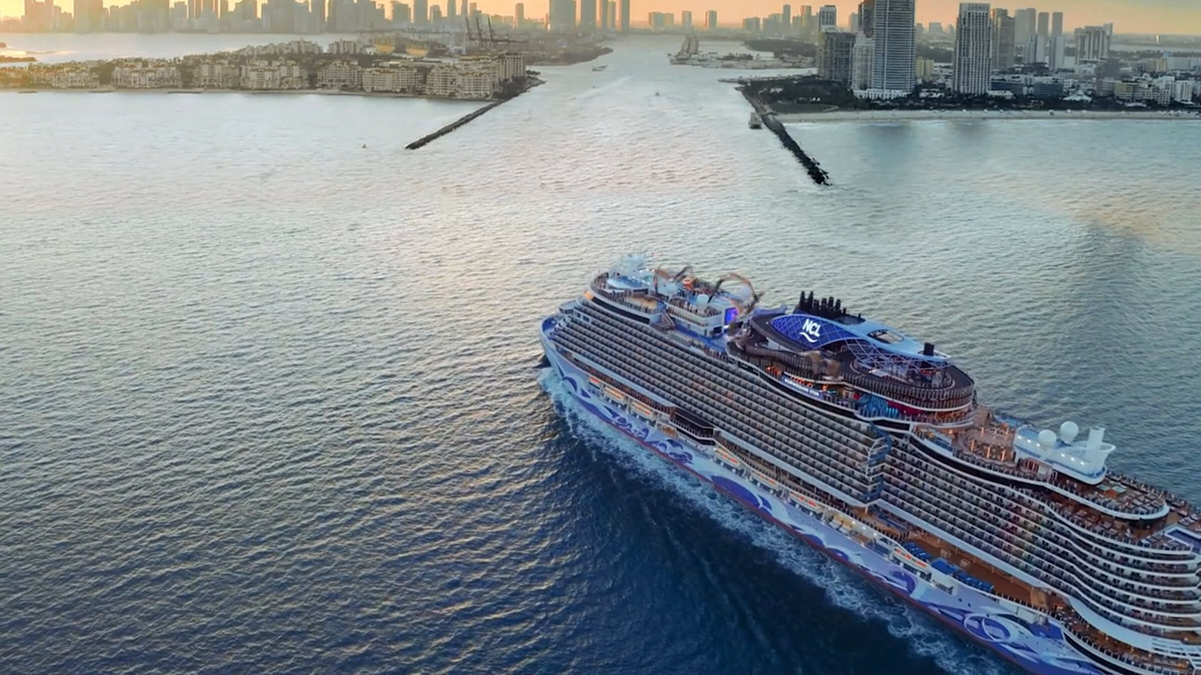 NCL cruise ship entering a bay