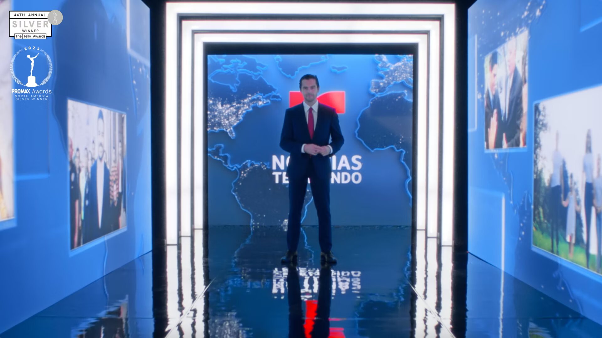 Julio Vaqueiro standing in front of a screen wall with the Noticias Telemundo logo